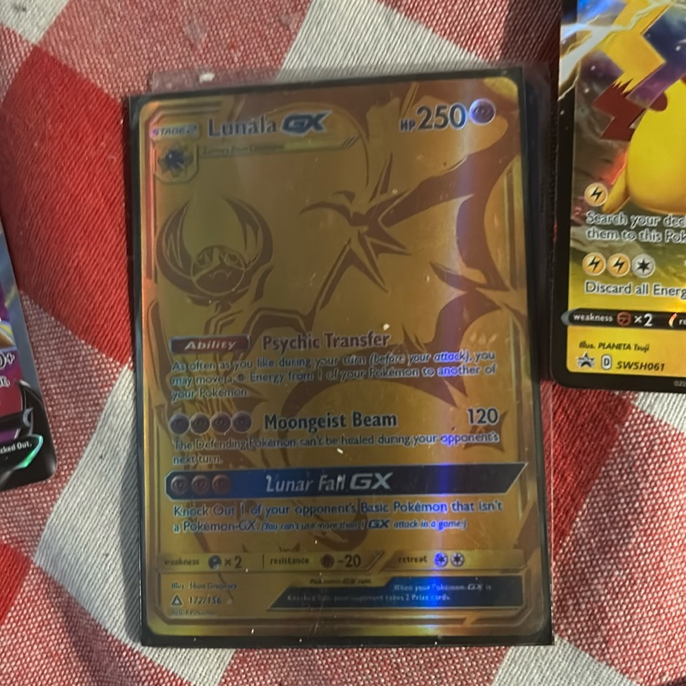 Lala GX stage two Pokémon card either the gold foil pack lunar fall GX